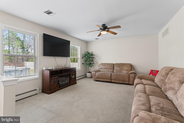 132 Heatherington Ct, Lanoka Harbor, NJ 08734 - carpeted living area featuring a baseboard heating unit, ceiling fan, and visible vents