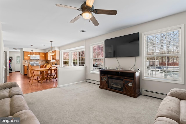 132 Heatherington Ct, Lanoka Harbor, NJ 08734 - living room featuring plenty of natural light, visible vents, and a baseboard radiator