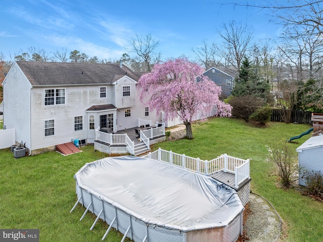 132 Heatherington Ct, Lanoka Harbor, NJ 08734 - rear view of house featuring central AC unit, fence, a deck, and a lawn