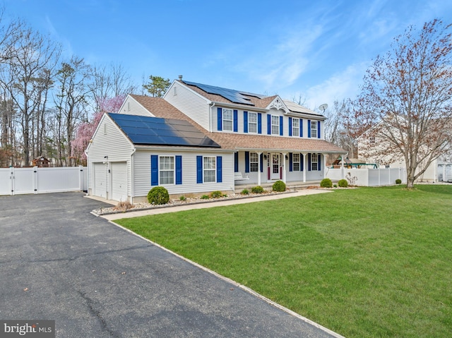 132 Heatherington Ct, Lanoka Harbor, NJ 08734 - view of front facade featuring aphalt driveway, covered porch, fence, a front lawn, and a gate