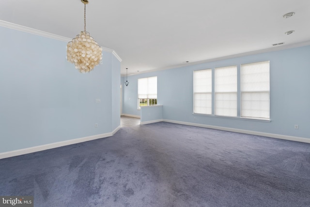 carpeted empty room featuring a chandelier, visible vents, baseboards, and crown molding
