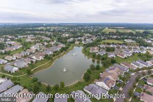drone / aerial view with a residential view and a water view