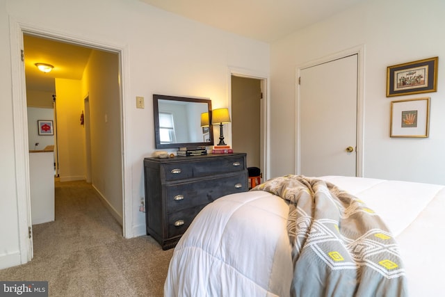 bedroom featuring carpet flooring and baseboards