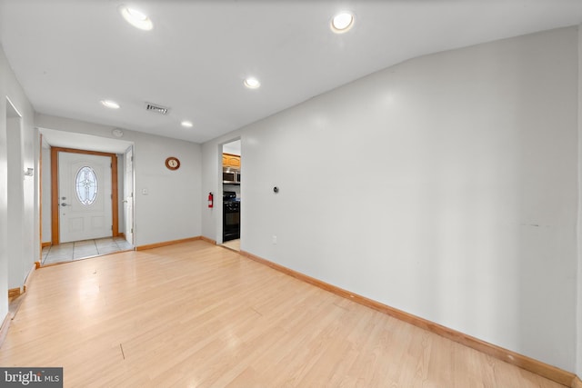 entryway with visible vents, baseboards, recessed lighting, and light wood-style floors