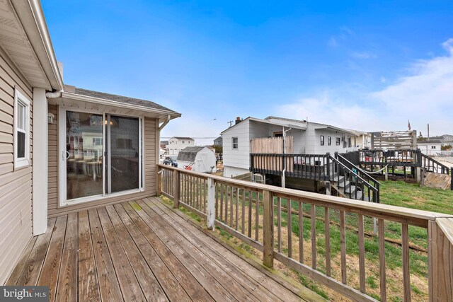 deck with a residential view and stairs