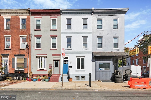 view of property with brick siding