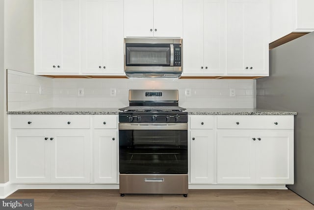 514 Bartholomew Dr, Waynesboro, PA 17268 - kitchen with light stone countertops, light wood finished floors, and appliances with stainless steel finishes