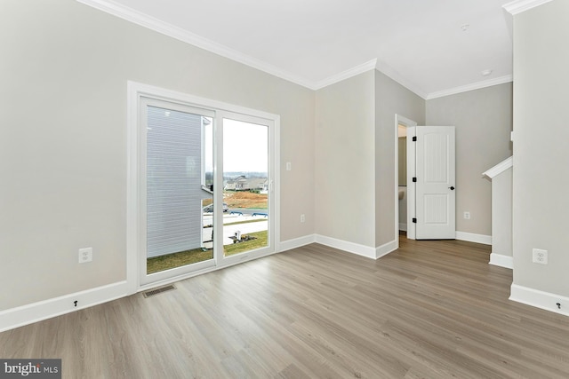 514 Bartholomew Dr, Waynesboro, PA 17268 - unfurnished room with crown molding, visible vents, baseboards, and wood finished floors