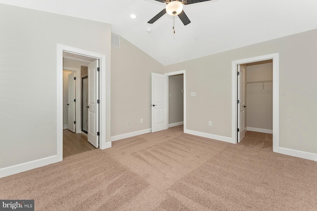 514 Bartholomew Dr, Waynesboro, PA 17268 - unfurnished bedroom with a walk in closet, visible vents, carpet flooring, and vaulted ceiling