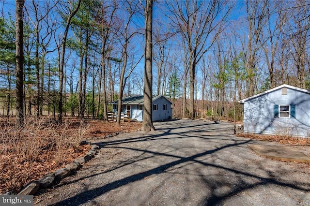view of street featuring aphalt driveway