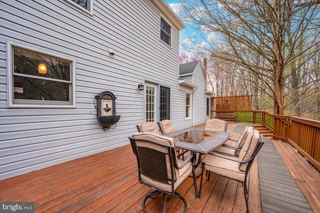 deck with outdoor dining space