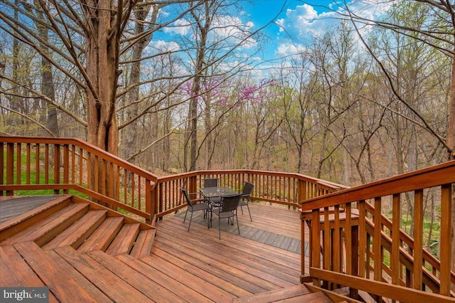 wooden deck with outdoor dining area
