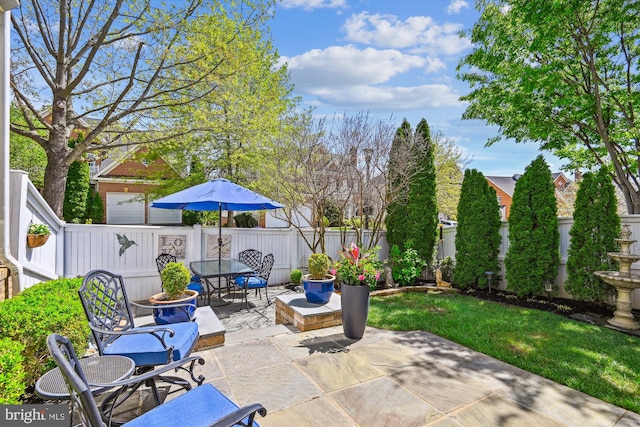 709 Pilot House Dr, Annapolis, MD 21401 - view of patio featuring outdoor dining area and a fenced backyard