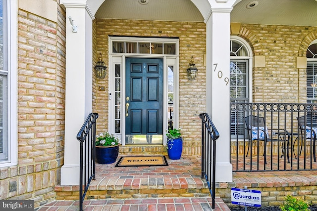 709 Pilot House Dr, Annapolis, MD 21401 - property entrance featuring brick siding and covered porch
