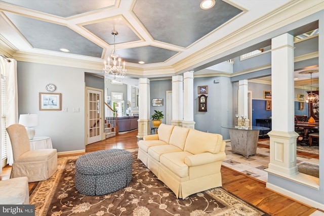 709 Pilot House Dr, Annapolis, MD 21401 - living room with decorative columns, wood finished floors, a notable chandelier, and ornamental molding