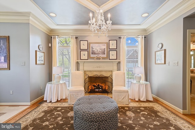 709 Pilot House Dr, Annapolis, MD 21401 - sitting room featuring a high end fireplace, wood finished floors, baseboards, and an inviting chandelier