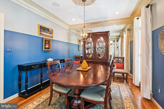 709 Pilot House Dr, Annapolis, MD 21401 - dining room featuring a chandelier, wood finished floors, crown molding, and baseboards