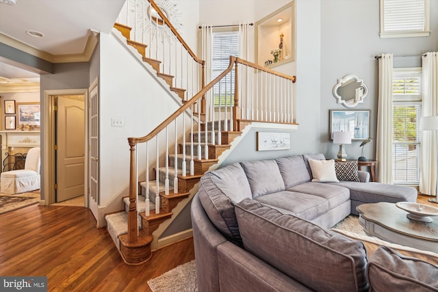 709 Pilot House Dr, Annapolis, MD 21401 - living area with crown molding, stairs, a healthy amount of sunlight, and wood finished floors