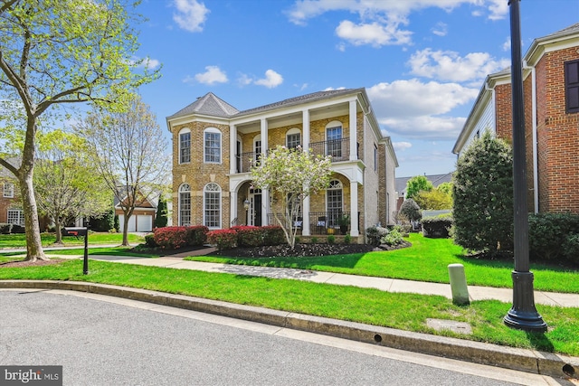 709 Pilot House Dr, Annapolis, MD 21401 - greek revival inspired property featuring brick siding, a balcony, and a front yard