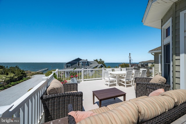 1082-E Long Beach Blvd, Long Beach Township, NJ 08008 - wooden terrace featuring a water view, an outdoor hangout area, and outdoor dining space