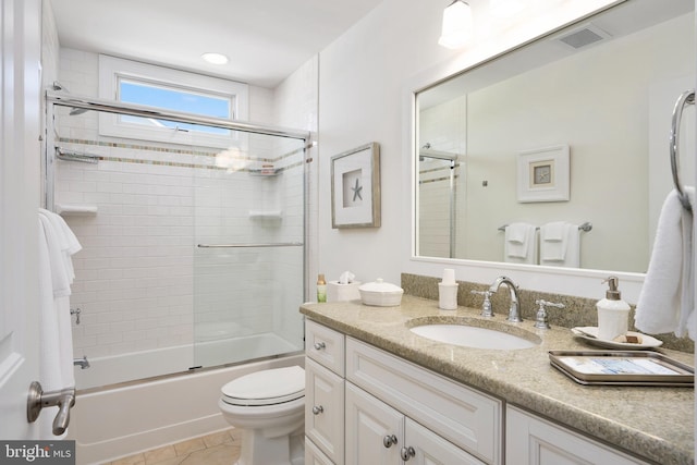 1082-E Long Beach Blvd, Long Beach Township, NJ 08008 - bathroom with vanity, toilet, tile patterned floors, and shower / bath combination with glass door