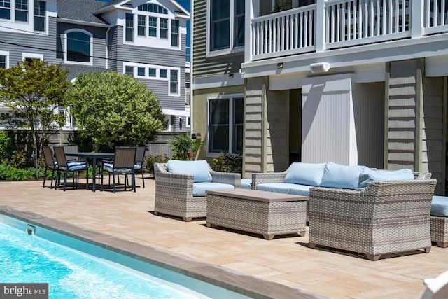 1082-E Long Beach Blvd, Long Beach Township, NJ 08008 - view of patio with an outdoor hangout area, a balcony, and fence