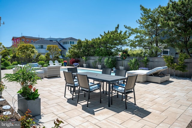 1082-E Long Beach Blvd, Long Beach Township, NJ 08008 - view of patio / terrace with outdoor dining space and a fenced backyard