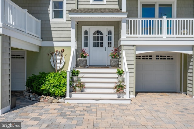 1082-E Long Beach Blvd, Long Beach Township, NJ 08008 - doorway to property with a balcony, an attached garage, and decorative driveway