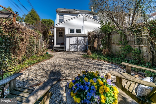 back of house featuring fence