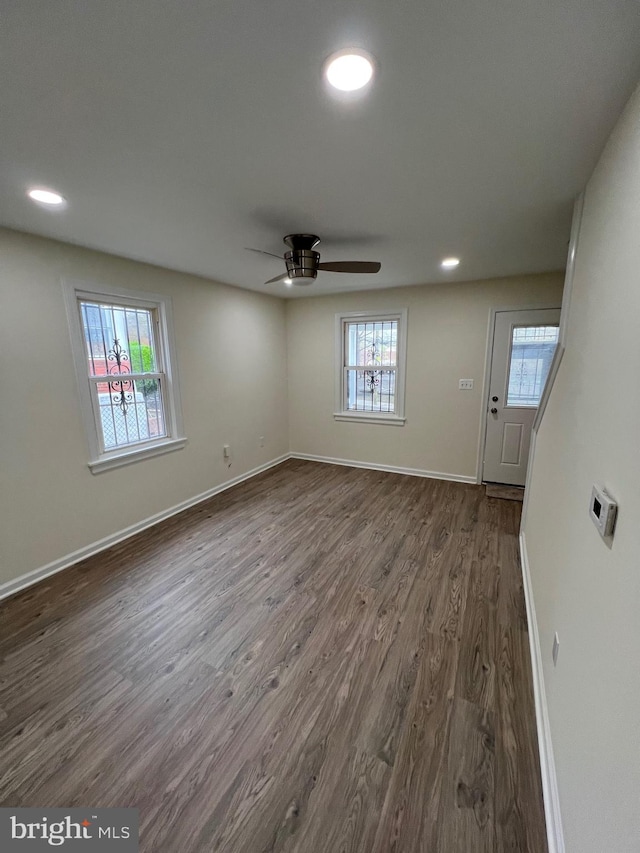 808 Division Ave NE, Washington, DC 20019 - unfurnished living room featuring ceiling fan, baseboards, dark wood finished floors, and recessed lighting