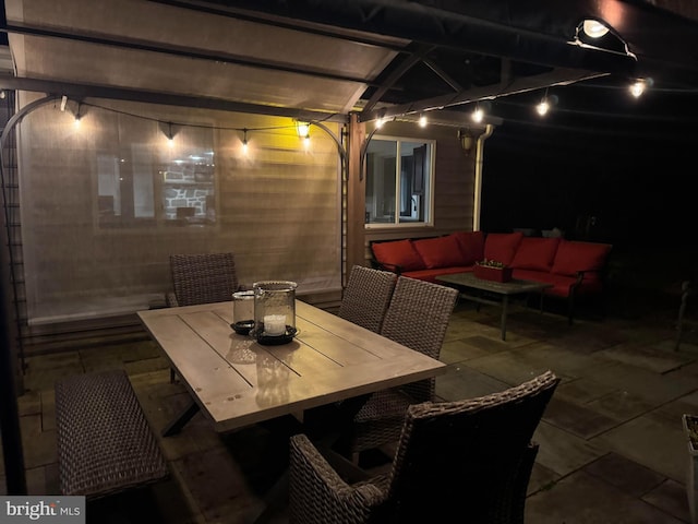 view of patio featuring outdoor dining area, outdoor lounge area, and a pergola