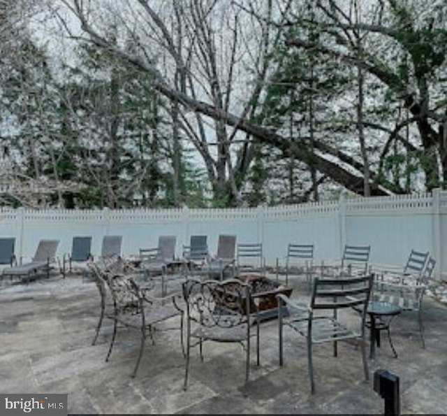 view of patio / terrace featuring fence