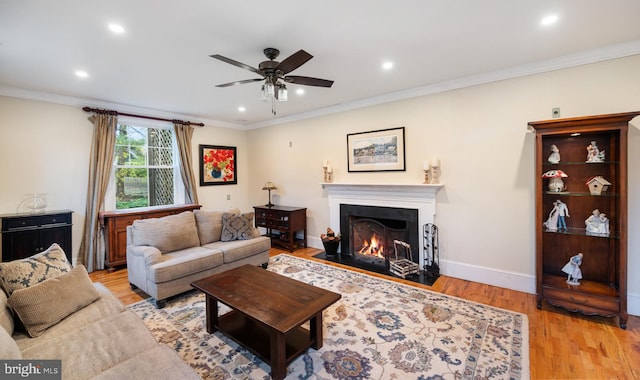 living room with ceiling fan, light wood-style floors, and recessed lighting