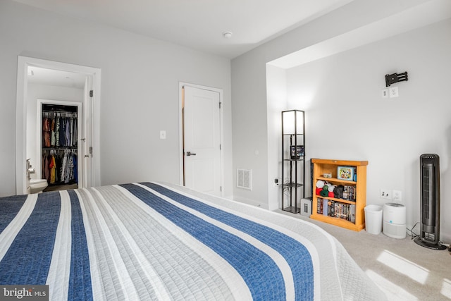 bedroom with visible vents and carpet floors