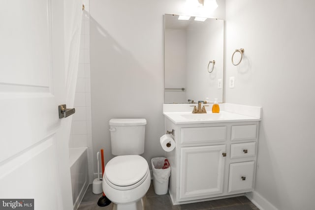 bathroom featuring toilet, vanity, baseboards, and shower / bath combination with curtain