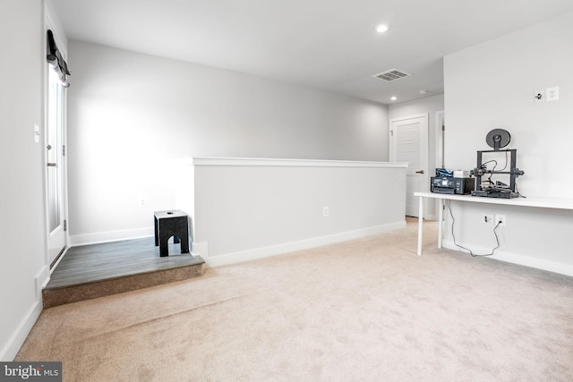 unfurnished living room featuring recessed lighting, carpet, visible vents, and baseboards