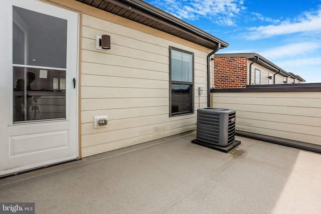 view of patio / terrace featuring central AC and a balcony