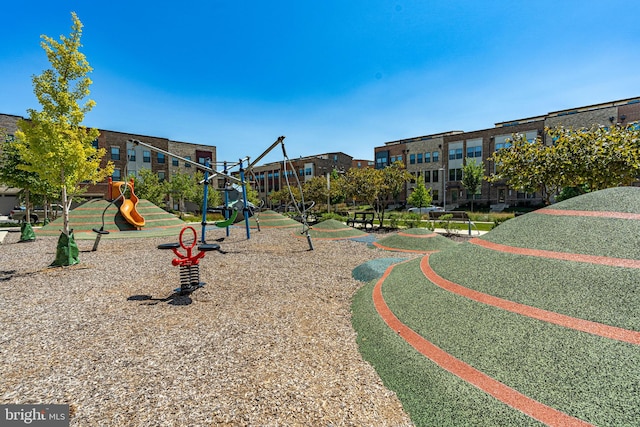 communal playground featuring a residential view