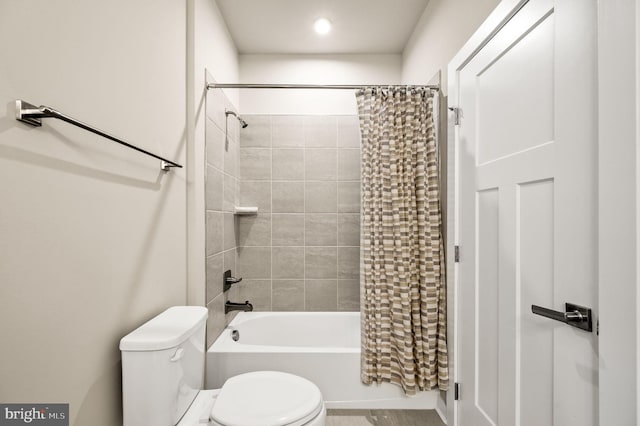 full bath featuring shower / tub combo and toilet