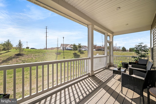 wooden deck with a yard