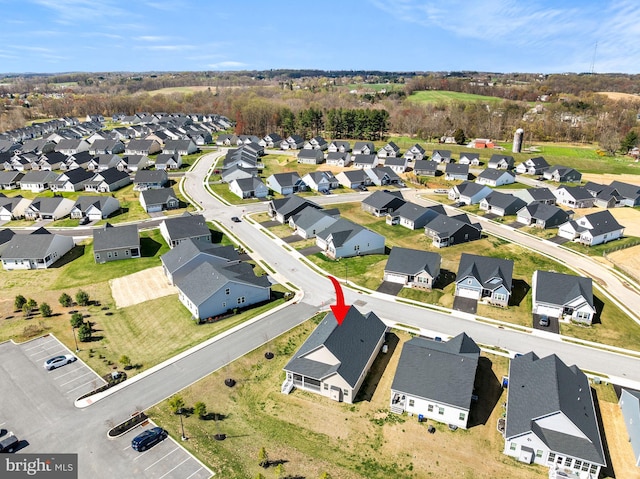 birds eye view of property with a residential view