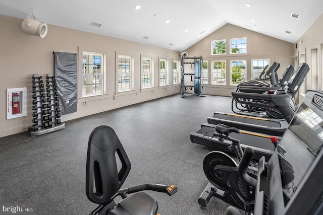exercise room with high vaulted ceiling, recessed lighting, visible vents, and baseboards