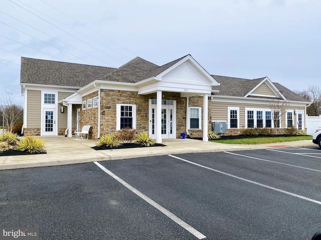 view of property featuring uncovered parking