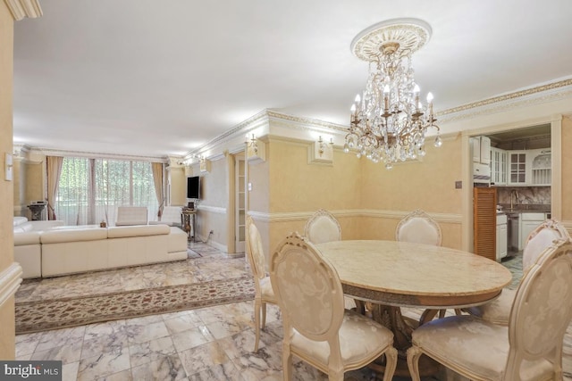 dining area with crown molding, marble finish floor, and a chandelier