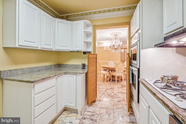 kitchen with white cooktop, white cabinets, oven, and marble finish floor