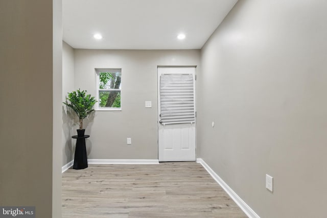 entryway featuring light wood-style flooring, baseboards, and recessed lighting