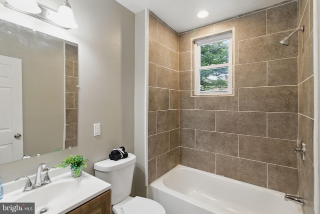 bathroom featuring vanity, toilet, and shower / bath combination