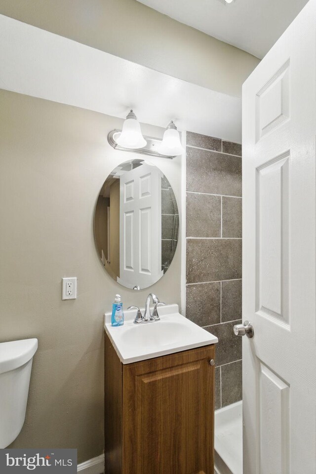 half bath with vanity and toilet
