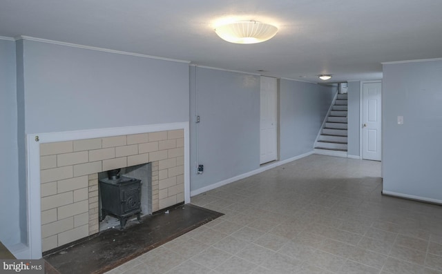 205 Polk Ave, Front Royal, VA 22630 - unfurnished living room with stairs, baseboards, a wood stove, and ornamental molding