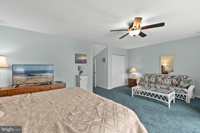 5401 Coastal Hwy Unit 306, Ocean City, MD 21842 - carpeted bedroom with a closet, baseboards, a textured ceiling, and ceiling fan